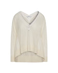 The Academy sweater by HIGH is a cream-colored V-neck crafted from soft crochet knit, featuring subtle perforated details on the sleeves and neckline, and a slightly high-low hem.