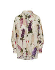 The HIGH Initiate blouse is a long-sleeve, button-up top with a collar, showcasing a cream base and vibrant botanical floral print in purple, pink, and green.