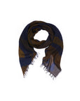 The SUZI ROHER “Lily, Elizabeth Brown” square scarf, showcasing a dark blue and brown striped pattern inspired by original artwork and finished with frayed edges, is neatly folded in a circular shape on a white background.