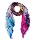 The SUZI ROHER "Earth" scarf is a lightweight, square accessory with frayed edges, showcasing a blue, pink and brown gradient and black handwritten-style script—evoking ocean clarity.