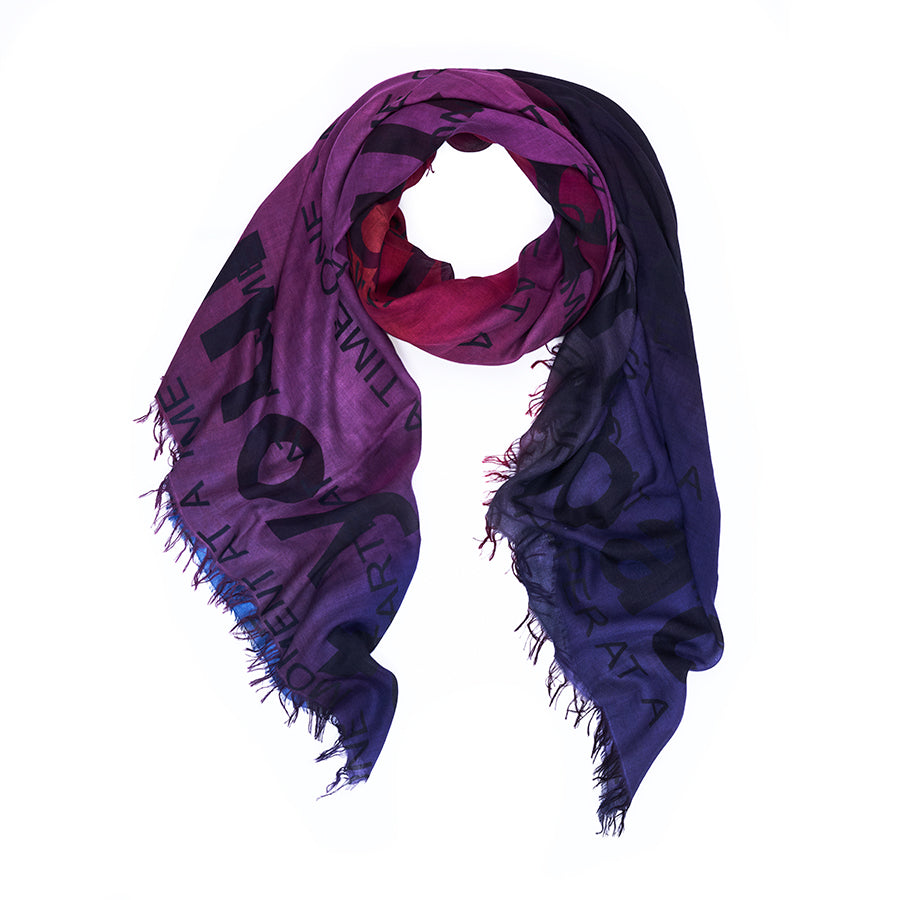 Introducing “Your Own Pace” by SUZI ROHER—a scarf with fringed edges, showcasing original artwork in a gradient from magenta to dark purple, adorned with large, bold black lettering printed across the fabric. This digitally printed piece is expertly finished in Italy.