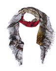 The SUZI ROHER “Number 6” scarf is a lightweight, rectangular accessory with frayed edges, showcasing an abstract design inspired by numerology art in shades of red, beige, brown, gold, and gray on a white background.