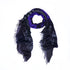 Here’s the rewritten sentence using your product data: The “Lucy” scarf by SUZI ROHER is displayed in a loose circular shape on a white background, showcasing its black and purple hues with fringed edges, adorned with polka dot and abstract patterns inspired by original digitally printed art.