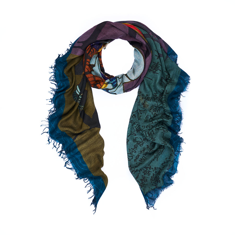 The SUZI ROHER “Honor” scarf is a multicolored accessory with frayed edges, showcasing abstract patterns and understated Japanese artwork and text on a vibrant backdrop of teal, blue, brown, and purple tones. It is presented against a white background.