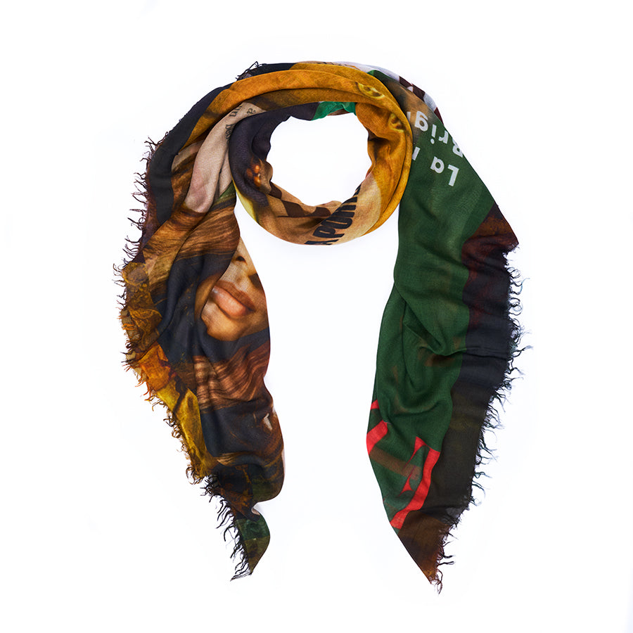 The “Elle” scarf by SUZI ROHER showcases vibrant abstract patterns and partial images of a woman’s face, its multicolored fabric artistically finished with frayed edges. Draped in a loop against a white background, this original artwork pays tribute to women’s empowerment and would be a striking statement piece in any fashion magazine.