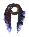 Introducing “Poetry” by SUZI ROHER: a lightweight scarf featuring original abstract artwork in purple, yellow, red, and blue tones. Digitally printed and finished in Italy with frayed edges, Poetry is displayed arranged in a loose loop on a white background.
