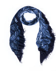 The SUZI ROHER Vogue Italia B&W is a dark blue and black fringed scarf featuring a textured, abstract pattern inspired by Milan artwork, elegantly arranged in a loose oval shape on a white background.