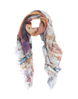 The Suzi Roher "Lucky In Love" scarf is a lightweight, rectangular modal silk piece with frayed edges and an abstract multicolored print in brown, purple, blue, and beige, styled in a loose circle for timeless 1940s allure.