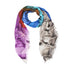 The Wild West scarf by SUZI ROHER is a lightweight modal silk accessory featuring an abstract design in blue, teal, orange, purple, and gray, finished with fringed edges for a modern take on cowboy style.