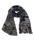 The Barefoot in the Park scarf by SUZI ROHER is a lightweight modal silk accessory with brocade plaid, black and white dots, and floral sections on a 70 x 200 cm fabric, shown loosely coiled against a white background.