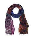 The SUZI ROHER Fashion Chatter scarf is a multicolored wool-modal accessory with an intricate pattern in blue, purple, red, green, and orange. Looped on a white background, it features subtly frayed ends—ideal for this season’s style.