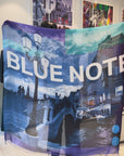Video of a scarf being put on - Collage of a cityscape with a bridge and street lamp, featuring the text 'BLUE NOTE' on a colorful background.