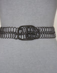 Displayed against a light gray background, the SUZI ROHER 6826 features a mannequin waist adorned with a black, intricately woven chain belt and a large oval-shaped buckle.