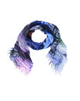 Introducing the “Lily, Sunset Blvd.” scarf by SUZI ROHER: this lightweight, rectangular accessory features a digitally printed multicolored abstract pattern—original artwork in shades of blue, purple, green, and pink. Frayed edges add texture and individuality to this unique piece, elegantly displayed in a loose spiral on a white background.