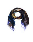The “Lily, Poetry” scarf by SUZI ROHER is a multicolored, lightweight accessory displayed in a circular arrangement on a white background. Featuring shades of blue, brown, yellow, and touches of green with frayed edges, this scarf showcases original artwork digitally printed for vibrant color and detail. Hand washable for easy care.