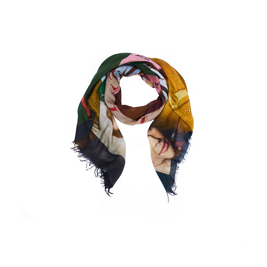 Introducing the Lily, Elle scarf by SUZI ROHER—an accessory adorned with original artwork and a striking abstract pattern on a white background. This multicolored scarf features frayed edges and is elegantly folded in a loop, capturing the vibrant energy of fashion magazine style in your everyday look.