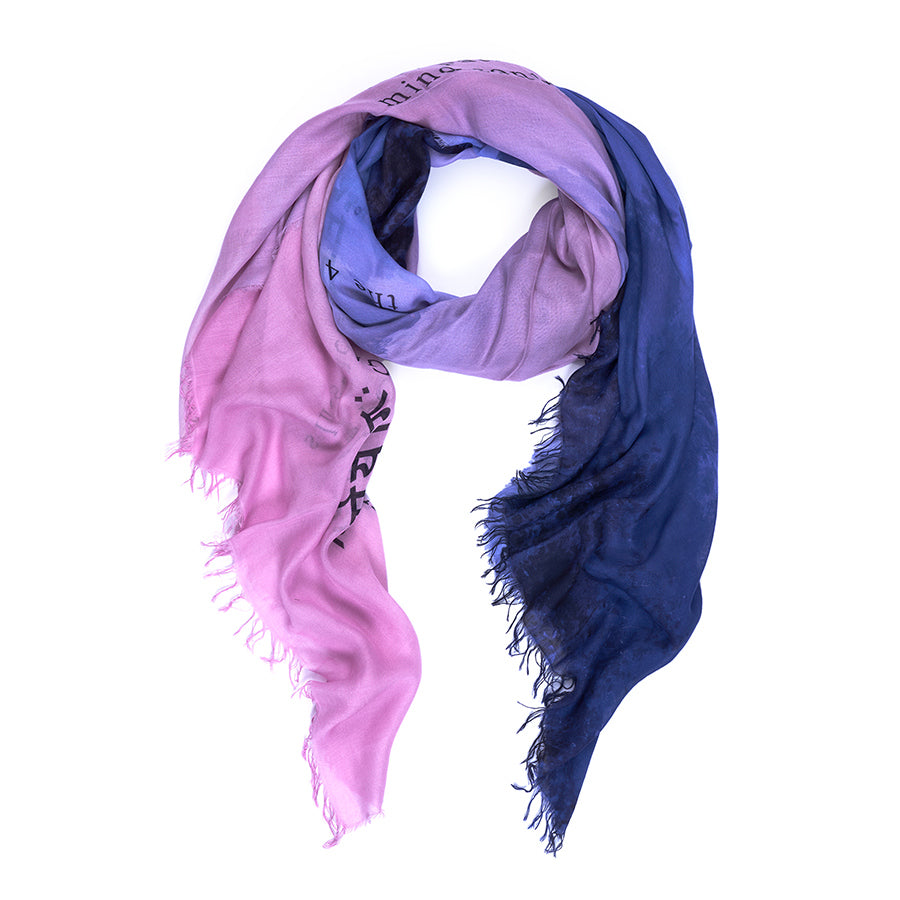 The 4 Paths of Yoga scarf by SUZI ROHER is a lightweight women's accessory with frayed edges, featuring a gradient from light pink to deep navy blue, loosely twisted into a loop.