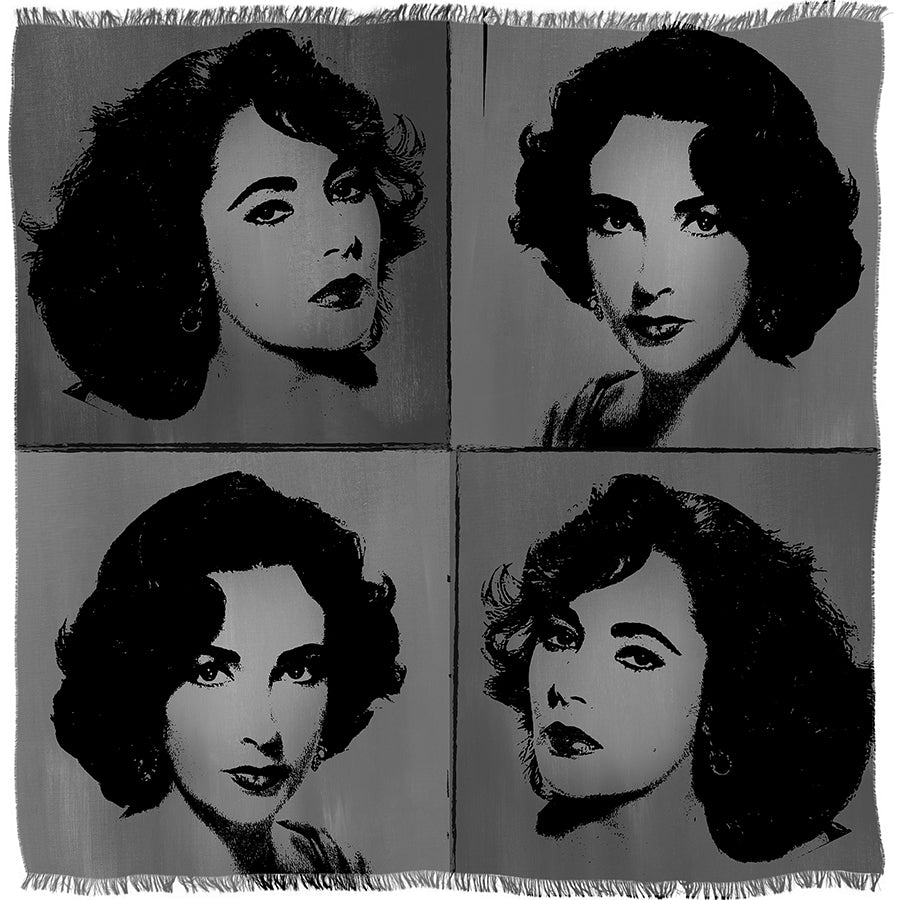 The SUZI ROHER “Elizabeth B&amp;W” woven blanket showcases a pop art-style design with four identical black and white portraits of a dark-haired woman, each positioned in its own quadrant.
