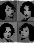 The SUZI ROHER “Elizabeth B&W” woven blanket showcases a pop art-style design with four identical black and white portraits of a dark-haired woman, each positioned in its own quadrant.