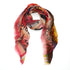 The For The Love Of scarf by SUZI ROHER is a colorful, lightweight accessory with frayed edges, featuring an abstract red, pink, yellow, brown, and black pattern plus handwritten-inspired self-care messages throughout.
