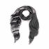 The SUZI ROHER Love Love-B&W scarf is a lightweight, rectangular accessory with frayed edges and a black-to-gray gradient. Displayed in a loose spiral, it radiates warmth against a white background.