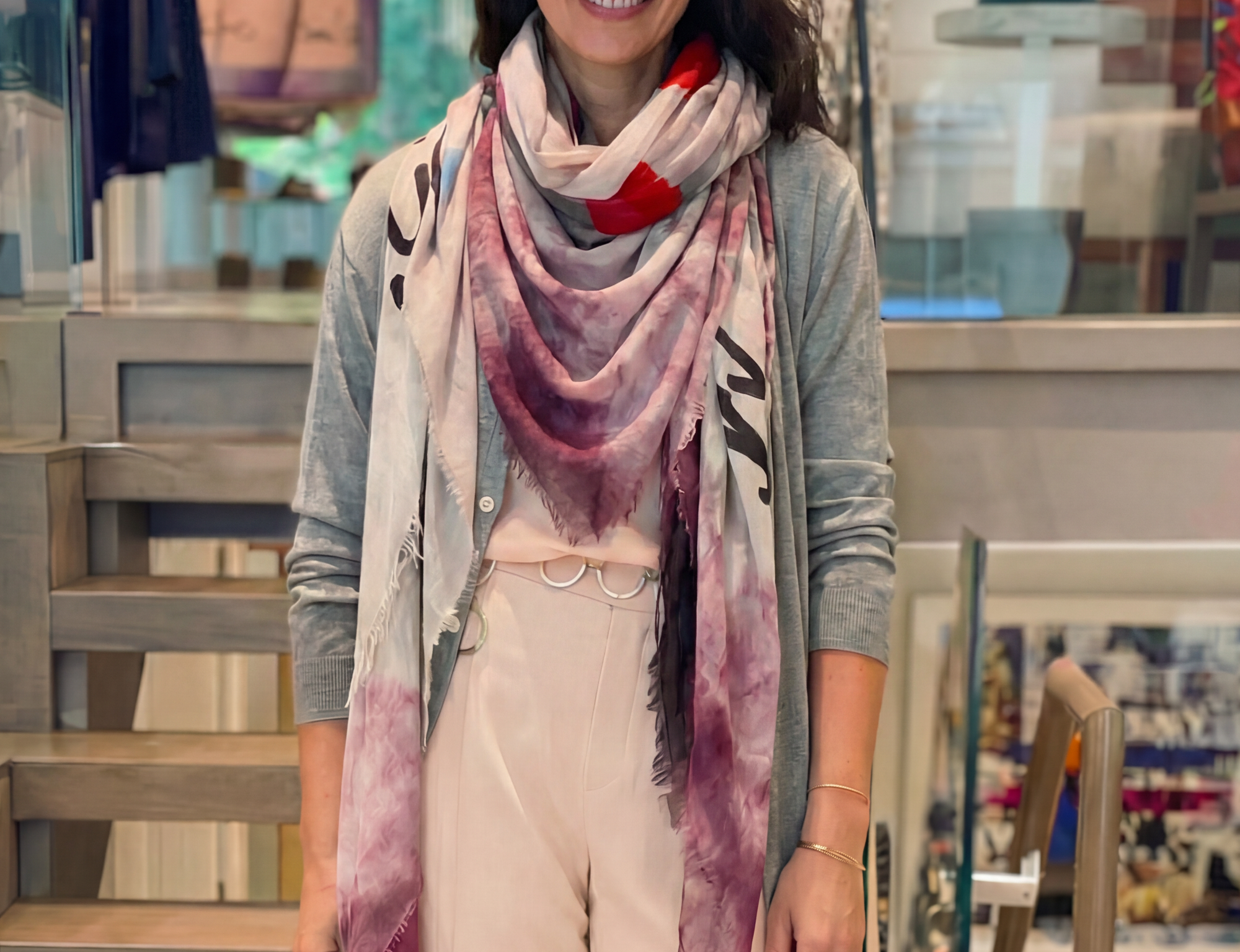 Close-up of a soft fabric with frayed edges in shades of pink and blush.