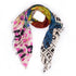 A multicolored scarf with a floral pattern and geometric designs laid out on a surface.