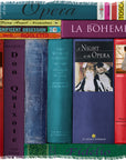A row of SUZI ROHER Opera books and sheet music, distinguished by colorful spines and classical art, showcases opera-themed titles such as Don Quixote, La Bohème, and La Traviata, all arranged upright amidst decorative accents.