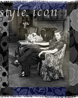 A vintage black-and-white photo features a woman seated in an armchair, framed by a patterned border with “Style Icon” inscribed at the top—a signature piece from SUZI ROHER that captures her relaxed confidence.