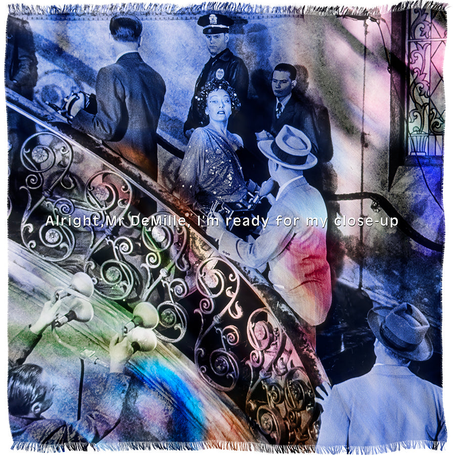 A black-and-white scene from Sunset Blvd. features a woman on a grand staircase surrounded by men, overlaid with rainbow colors and the phrase: “Alright, Mr. DeMille, I’m ready for my close-up.” Artwork by SUZI ROHER.