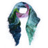 The SUZI ROHER "Beautiful Flower" scarf is a lightweight modal-silk blend with frayed edges, showcasing an abstract pattern in green, blue, pink, and black on white.