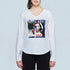 A woman wears The Victoria by SUZI ROHER, a slim-fit, long-sleeve cotton V-neck tee with a vibrant graphic of a woman's face and the words "BIZZARE" at the top and "ART" at the bottom, set against a light background.