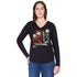 A woman wears SUZI ROHER's The Victoria—a 100% cotton black long-sleeve shirt with a colorful vintage fashion models graphic—paired with blue jeans, facing the camera with one hand on her hip.
