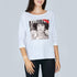 A woman wears The Bailey by SUZI ROHER—a boxy cut tee with three-quarter sleeves, boat neckline, and a chic black-and-white print inspired by VANITY FAIR and Coco Chanel.